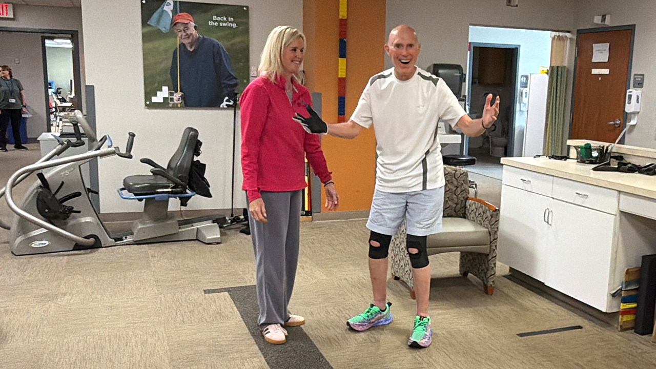 man standing with therapist