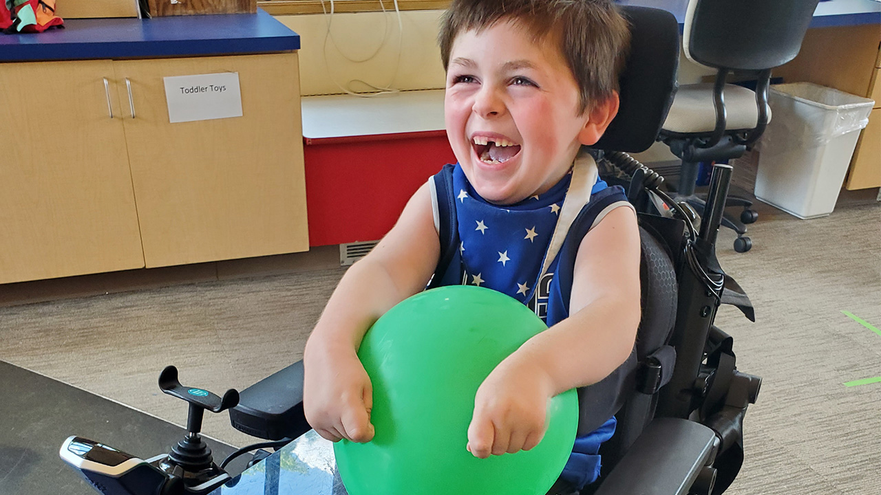 young boy with balloon